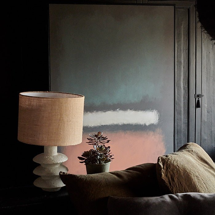 The Helia Abstract Print, a dramatic print of coral, inky blue and white tones on a black background with a slim black frame.