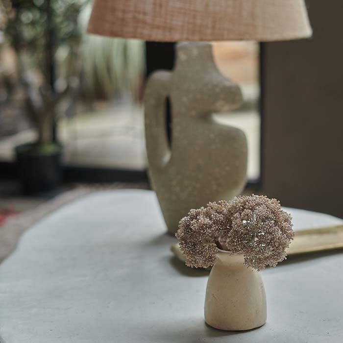 Artificial sedum in a paper mache bud vase.