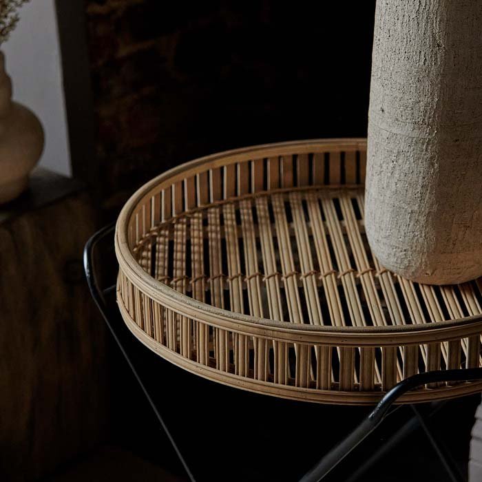 A closeup of the Rosia Bamboo Side Table showing the slatted bamboo detail of the tray.