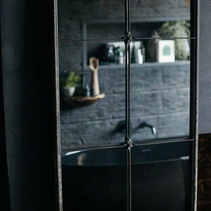 Decorative iron detailing on the Ashford Mirror in a window-pane style.