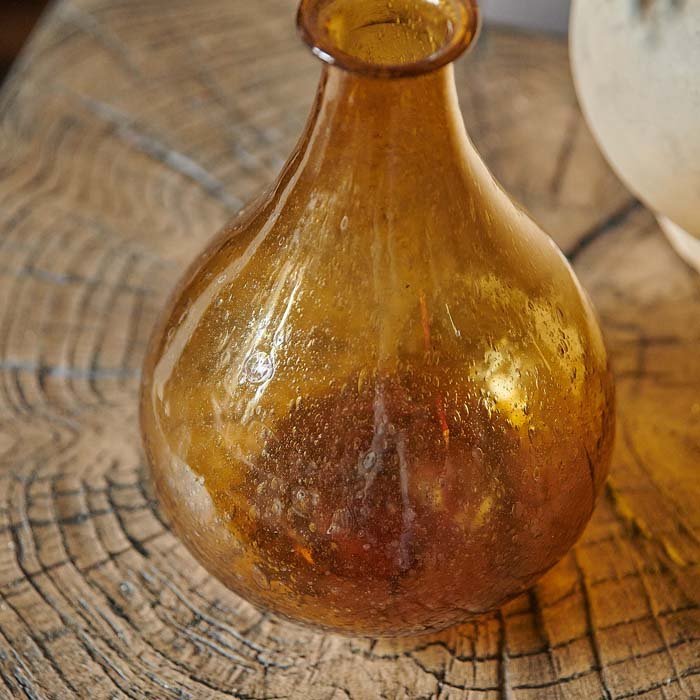Bubble texture in an amber glass vase.