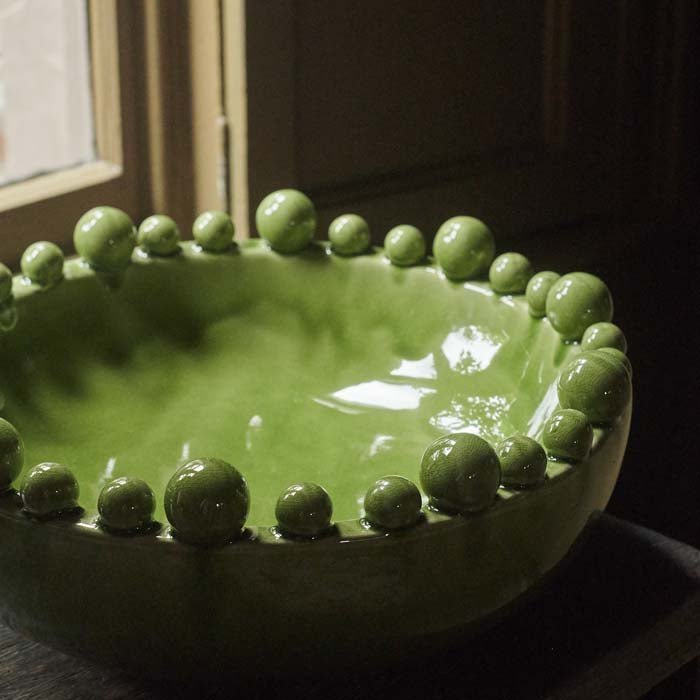 The Bourton Bowl - Green, a large round bowl with a glossy glazed finish and textural bubble top.