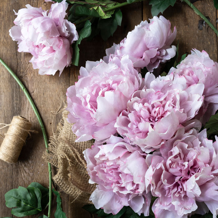 Luxury artificial peony flowers in soft pink. These lifelike flowers add a chic look to any home decor style, and look chic in a flower arrangement or add a natural garden flowers look to your interior. Realistic artificial flowers with soft pink lifelike petals.