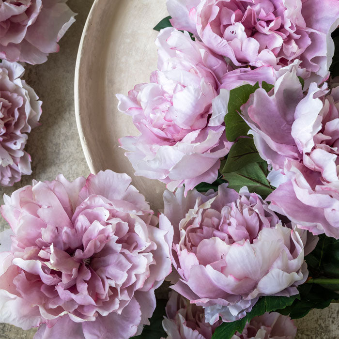 Artificial pink peony blooms.