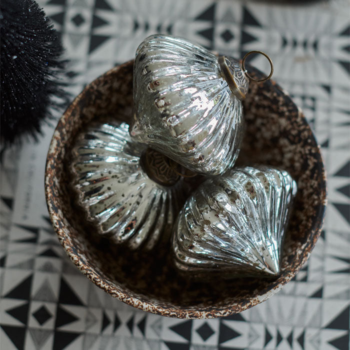 Three antique silver acorn-shaped baubles 