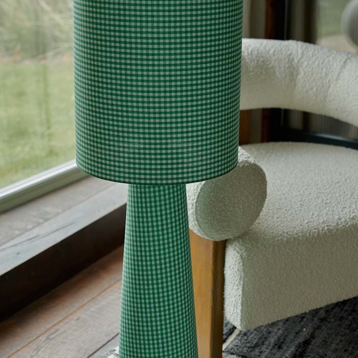 A closeup of the green gingham patterned fabric on the Rylan Floor Lamp - Green Gingham.