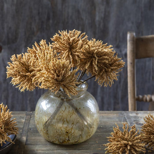 Floral arrangement of faux soft brown coloured Meadow Pompom Thistles in a glass vase. Add these premium fake flowers to any bouquet in your home to add a personal touch.