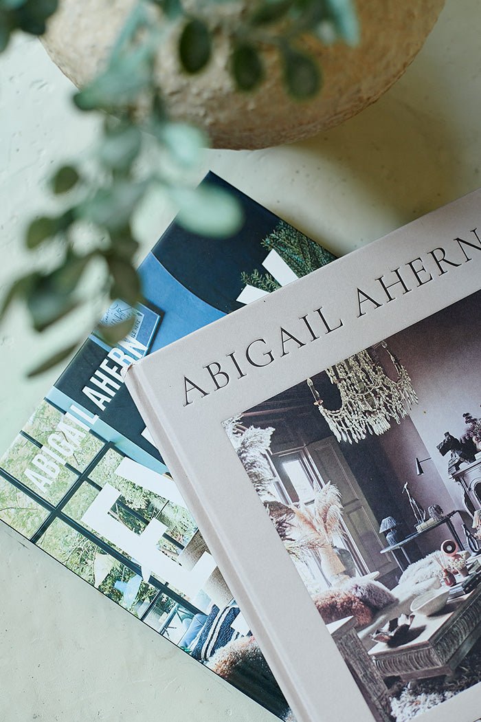 Close up image of the covers of Abigail Ahern's two hardback books that come in this interior design book bundle. 