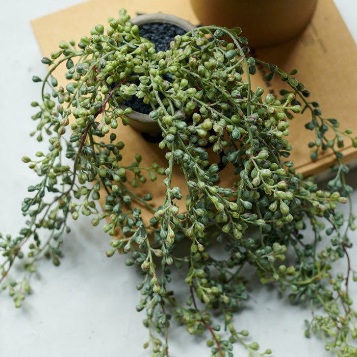 Artificial Trailing String of Beads