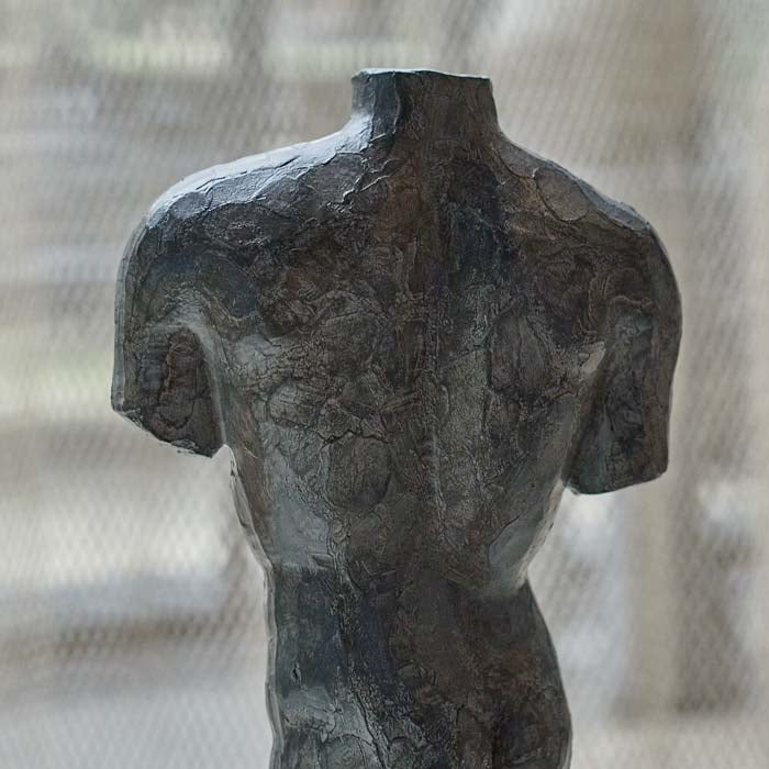 A closeup of the faux metal finish on the Adonis Sculpture.