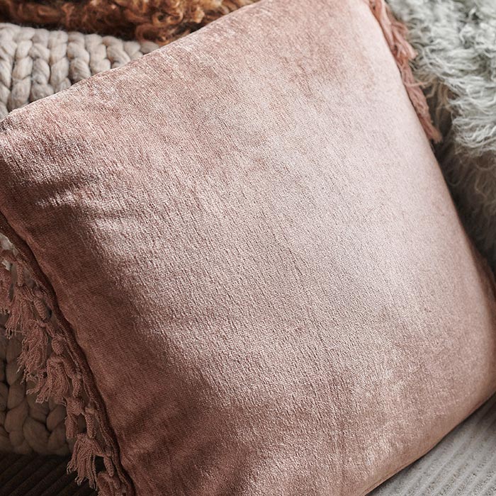 A closeup of the back part of the soft dusky pink Uvero Cushion.