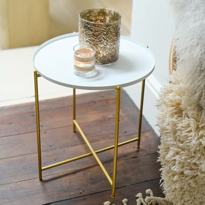 The Sandford Side Table - White, styled with a large gold coloured textured votive and a smaller clear glass one.