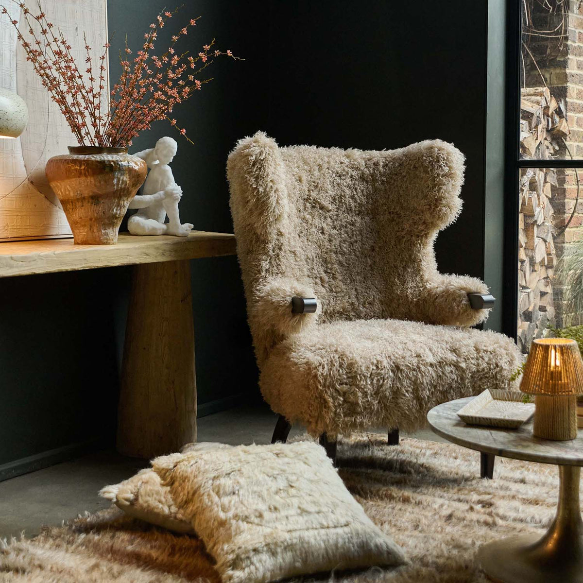Beige faux fur armchair with a soft textured finish, deep cushioned seat and timeless curved silhouette. Chalford Faux Fur Armchair by Abigail Ahern, designed for ultimate comfort and relaxed lounging while adding warmth and texture to modern interiors. A luxury accent chair perfect for living rooms, bedrooms, reading corners and cosy spaces, creating an inviting statement piece for contemporary home decor.