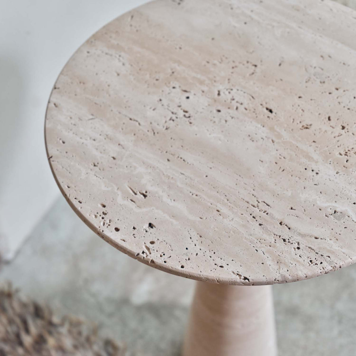 Abigail Ahern Daytona Marble Side Table with a textured round marble top 