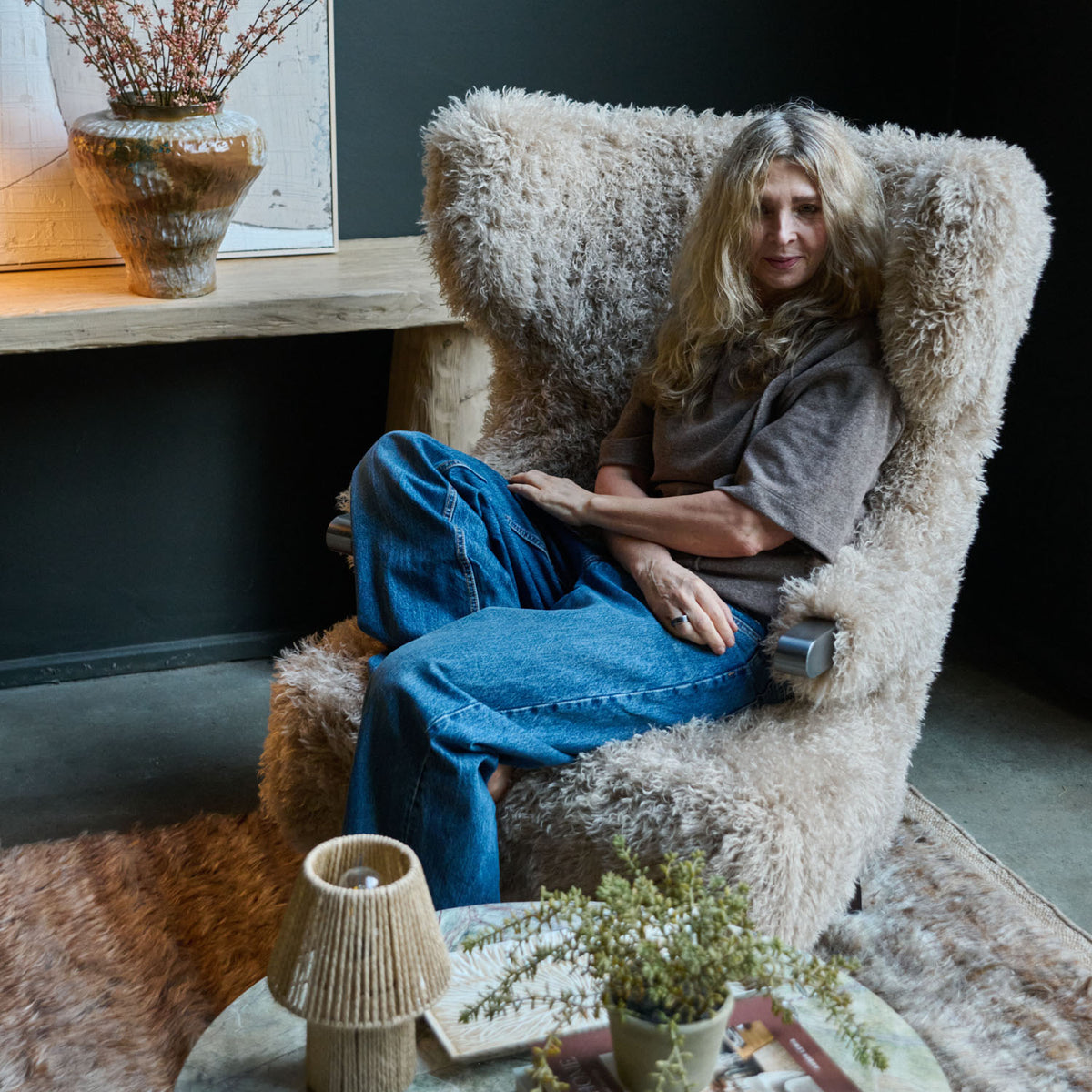 Beige faux fur armchair with a soft textured finish, deep cushioned seat and timeless curved silhouette. Chalford Faux Fur Armchair by Abigail Ahern, designed for ultimate comfort and relaxed lounging while adding warmth and texture to modern interiors. A luxury accent chair perfect for living rooms, bedrooms, reading corners and cosy spaces, creating an inviting statement piece for contemporary home decor.