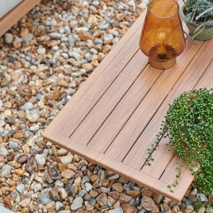 Wood-effect metal outdoor table.