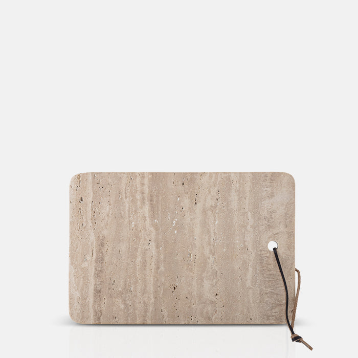 Travertine serving board on a white background.