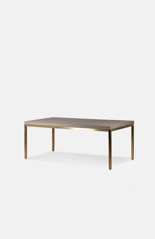 Cutout image of the neutral coloured, rectangular Alameda Dining Table from Abigail Ahern, an interior design brand rated excellent on Trustpilot.