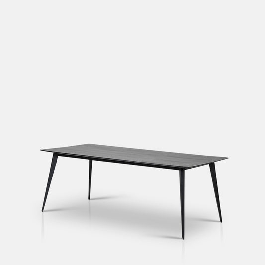Black dining table on a white background.