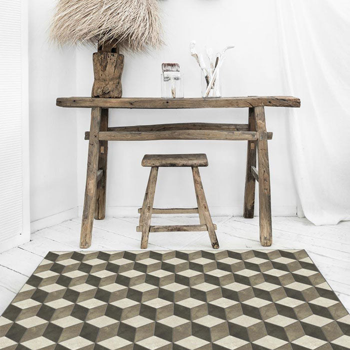 Geometric monochrome pattern on a vinyl rug laid out in front of a wooden desk