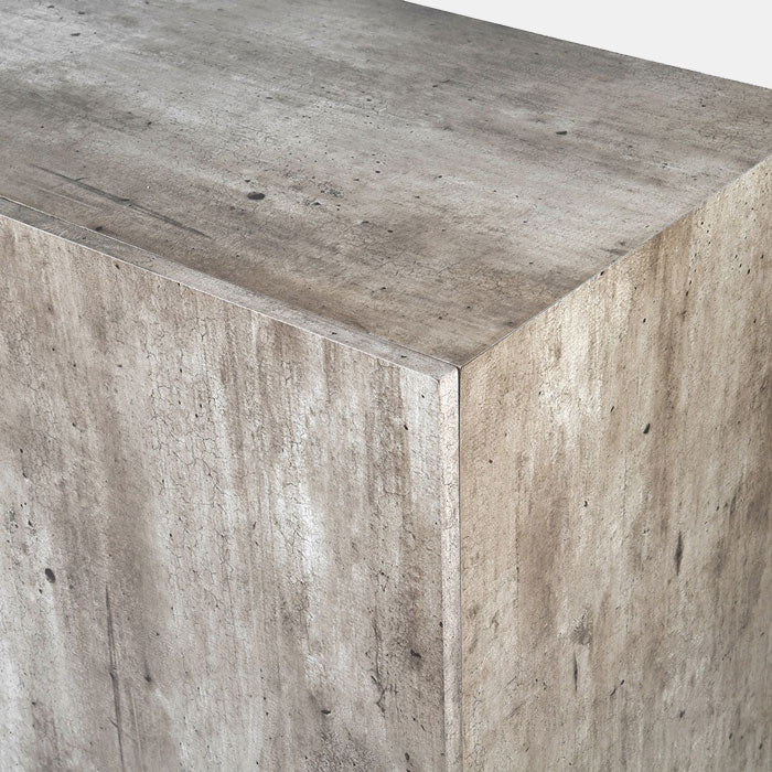 A closeup of the faux-concrete finish on the Alberton Side Cabinet.