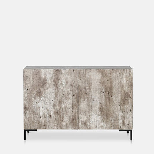 Cutout of a grey, faux concrete side cabinet with four small black metal feet and two cupboard doors.