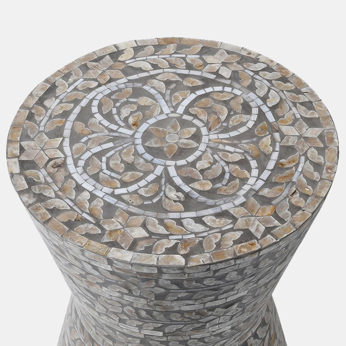 Grey capiz shell mosaic on top of a round stool