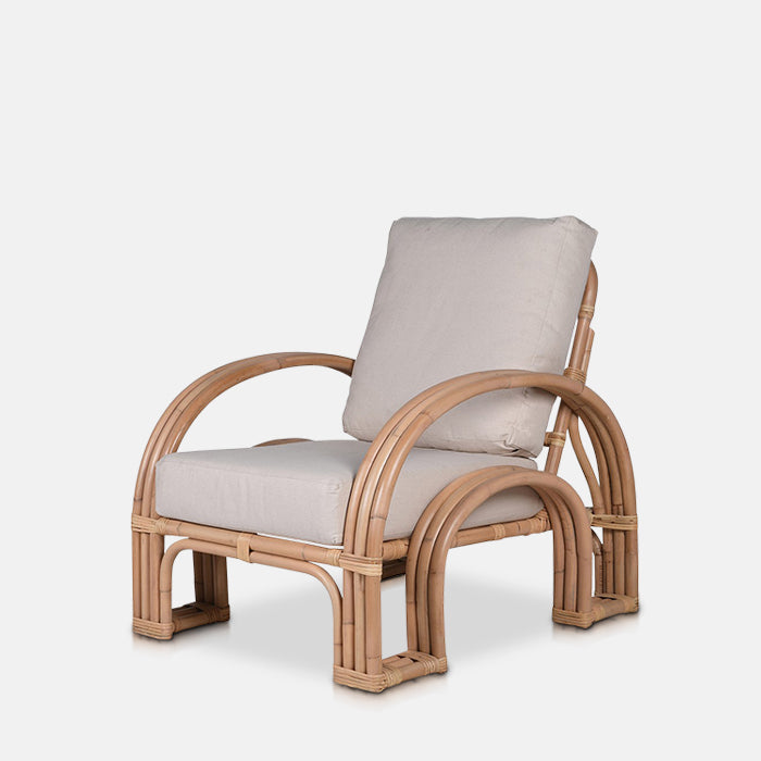 Bamboo framed armchair with arched sides and grey cushioning