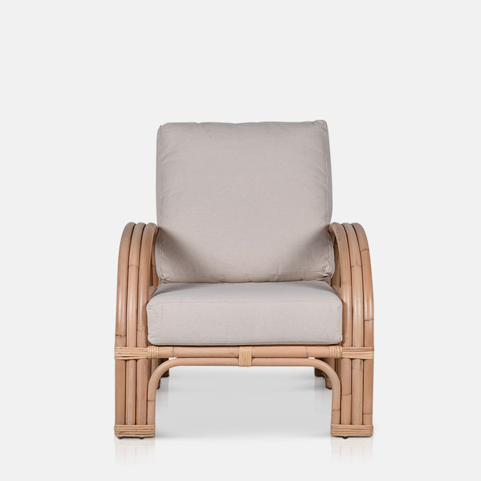 Chunky grey cushioning on a bamboo armchair