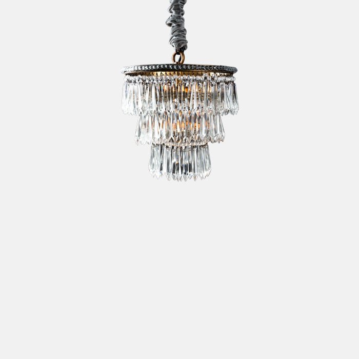Three tiered glass chandelier with golden metal frame.