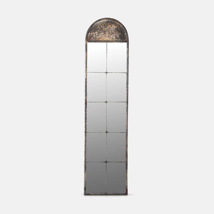 A cutout of the Ashford Mirror, a tall antique-look relief top arch-shaped mirror in window design.