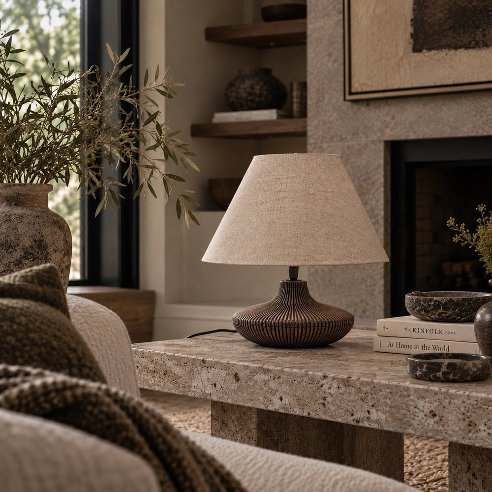 Ballard Wooden Table Lamp with sculptural wood base and neutral shade, styled on a side table in a warm contemporary interior.