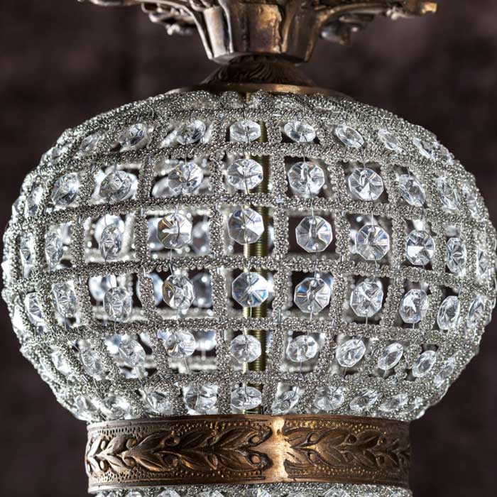 Clear glass beads on ballroom chandelier.
