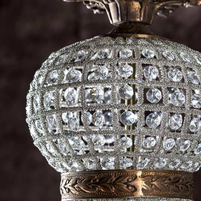 Round clear glass beads on a chandelier.