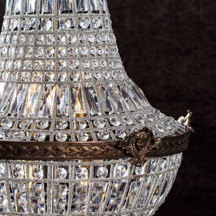 A closeup of the aged look metal detailing on the Ballroom Chandelier - Medium.