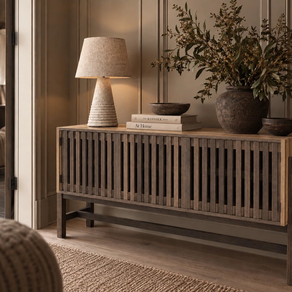 Batten Wooden Sideboard with dark slatted wood frame and contrasting timber doors, styled with sculptural ceramics and neutral decorative accessories.