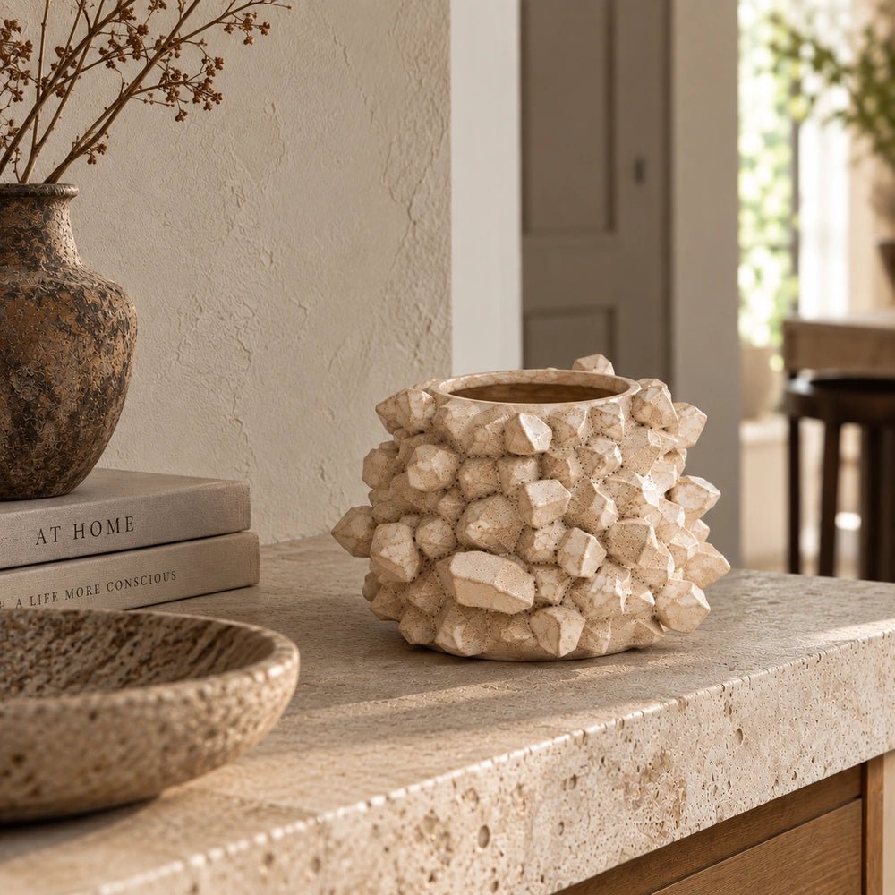 Bricket Textured Vase with tall dark sculptural form and rough finish, styled with dried branches on a console table in a warm neutral interior.