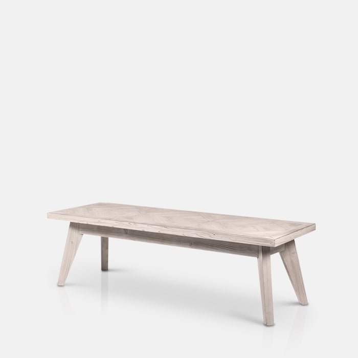  A cutout of the Bronson Parquet Bench. A herringbone wooden tiled patterned bench.