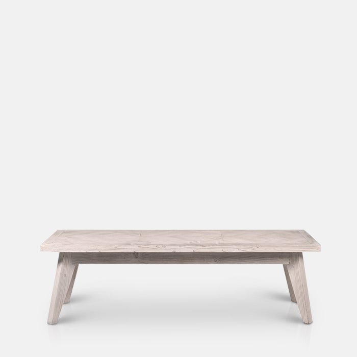  A cutout of the Bronson Parquet Bench. A herringbone wooden tiled patterned bench.