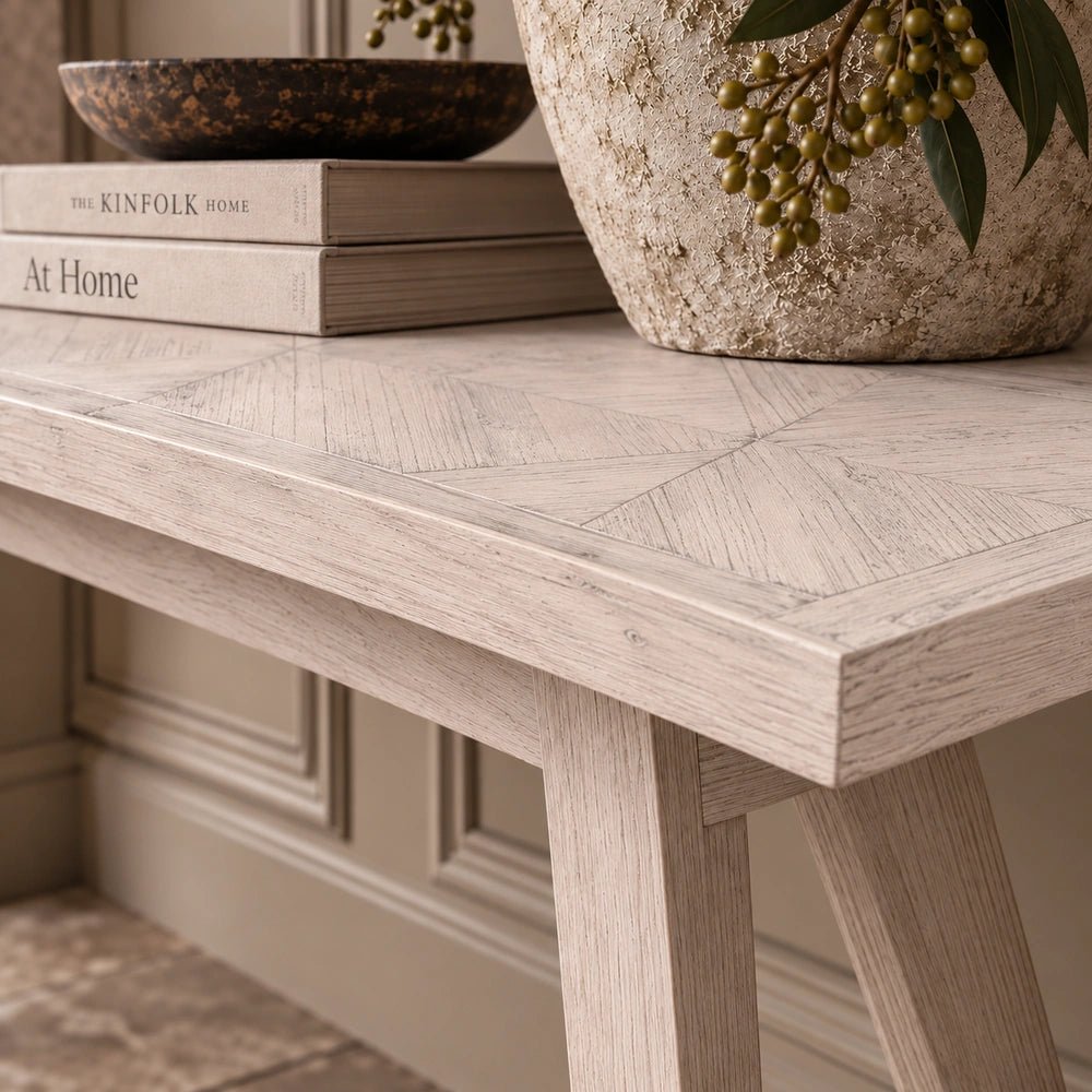 Bronson Parquet Console Table shown in close-up, highlighting the geometric dark wood parquet pattern, textured grain and angular edge detail.