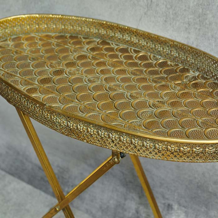 Gold decorative cutout pattern on foldable tray table