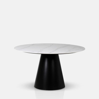 Round faux white marble table top on a chunky black base