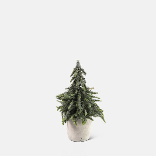 A mini decorative Christmas tree in a stone-look pot.