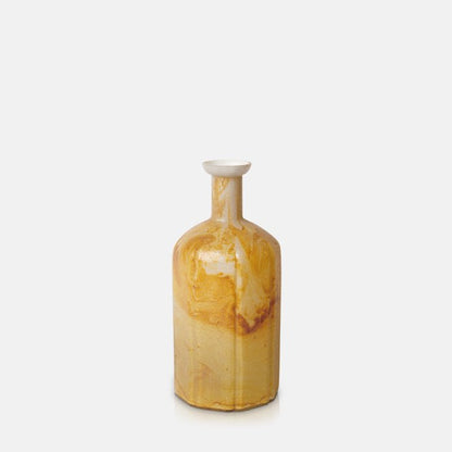 Cutout of a bottle shaped glass vase with orange marbling and a narrow neck. Shop now from Abigail Ahern, in homes since 2003. 