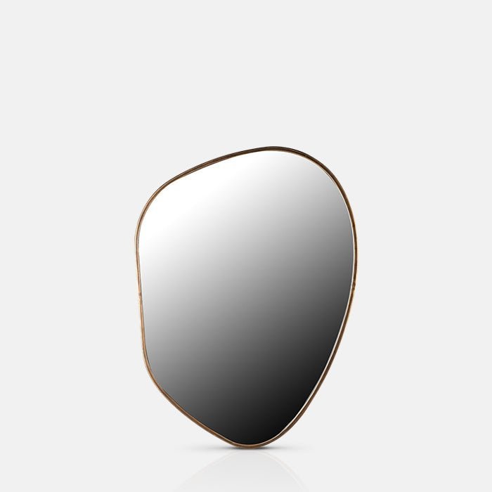 A cutout of the Casper Mirror - Medium, a contemporary mirror with an irregular organic shape and a slim gold iron frame.