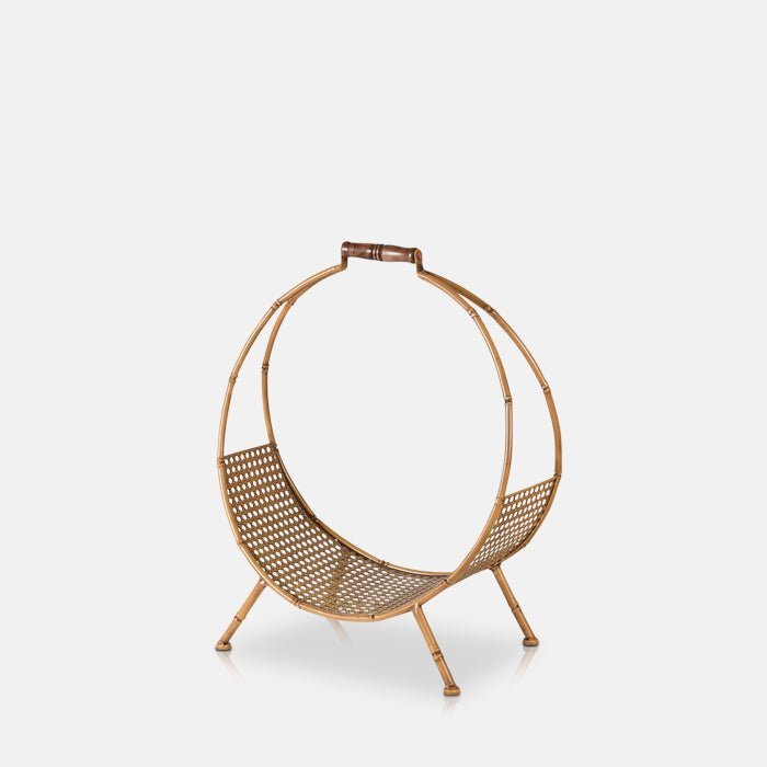 A cutout of the Cohen Log Holder, a bamboo style round log holder with a rattan bottom and four short legs.