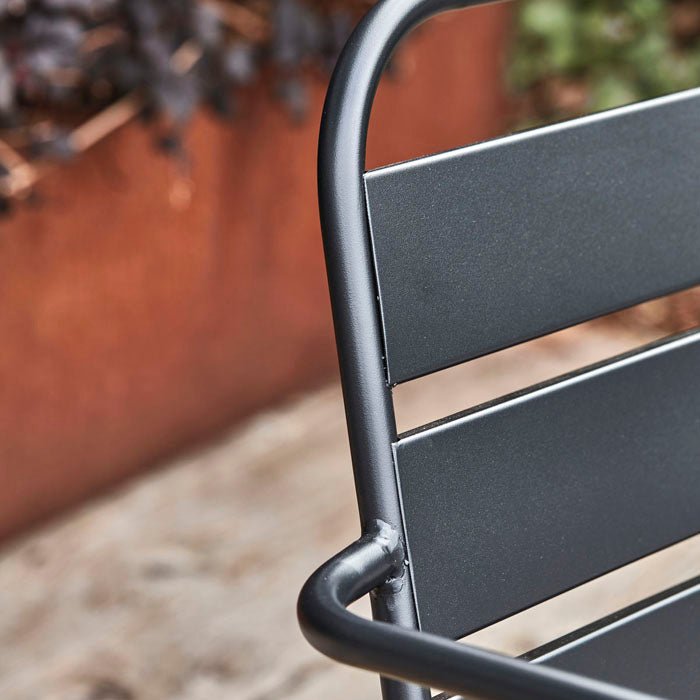 Detail image of the black finish on our dark metal outdoor lounge chair