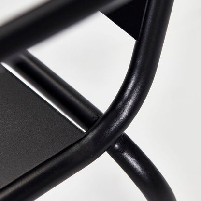 Close up image of the details of the black iron lounge chair.