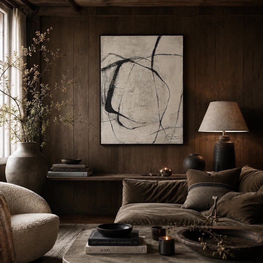 Entangle Canvas Art with monochrome abstract lines displayed on a dark wall above a low console, surrounded by neutral seating, ceramics and leafy branches.