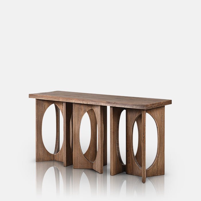 The Epping Console Table, a slim rectangular table in recalimed elm with an elaborate circular cutout shaped base.